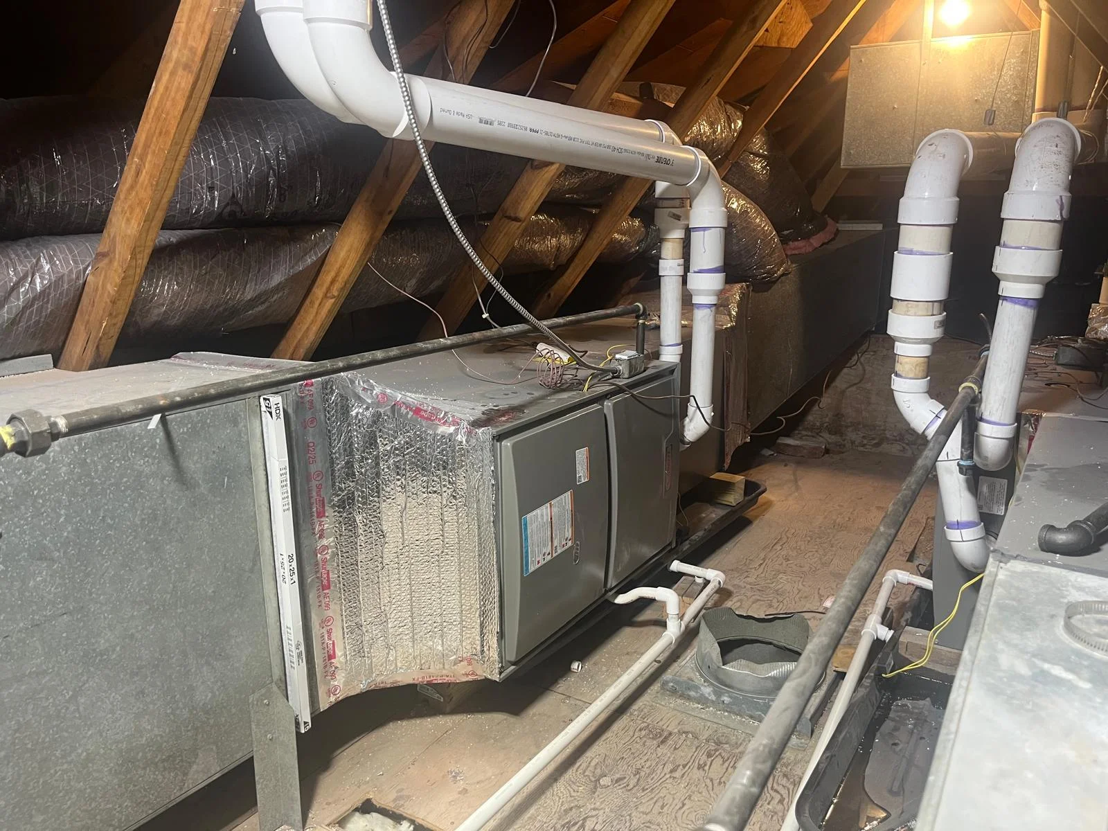 Residential horizontal furnace and evaporator coil installation in attic